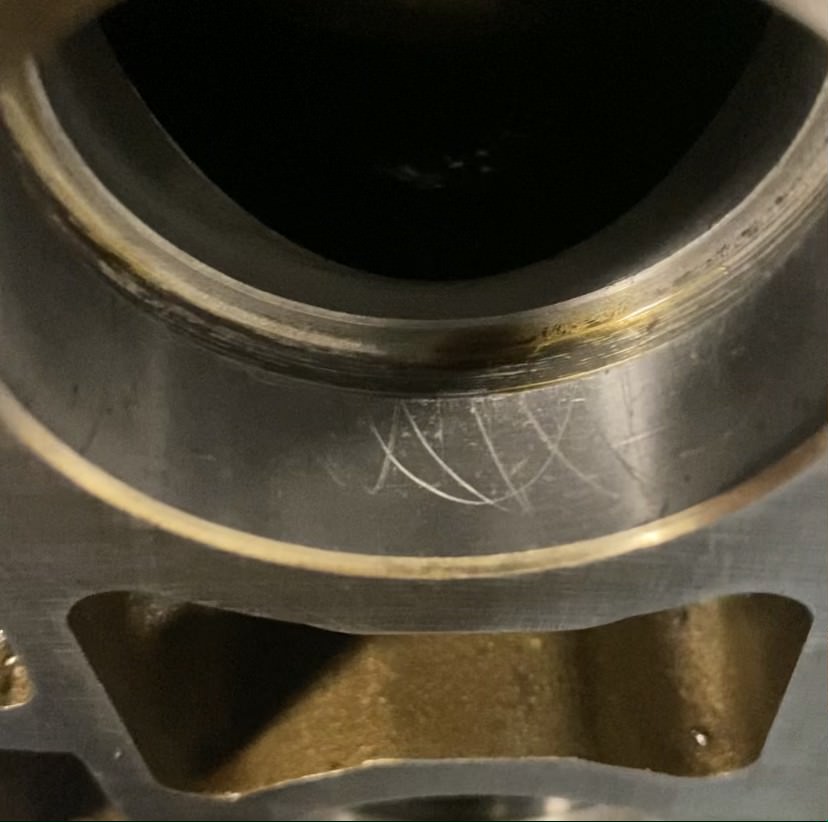 Close up on cam tower lifter cylinder scouring