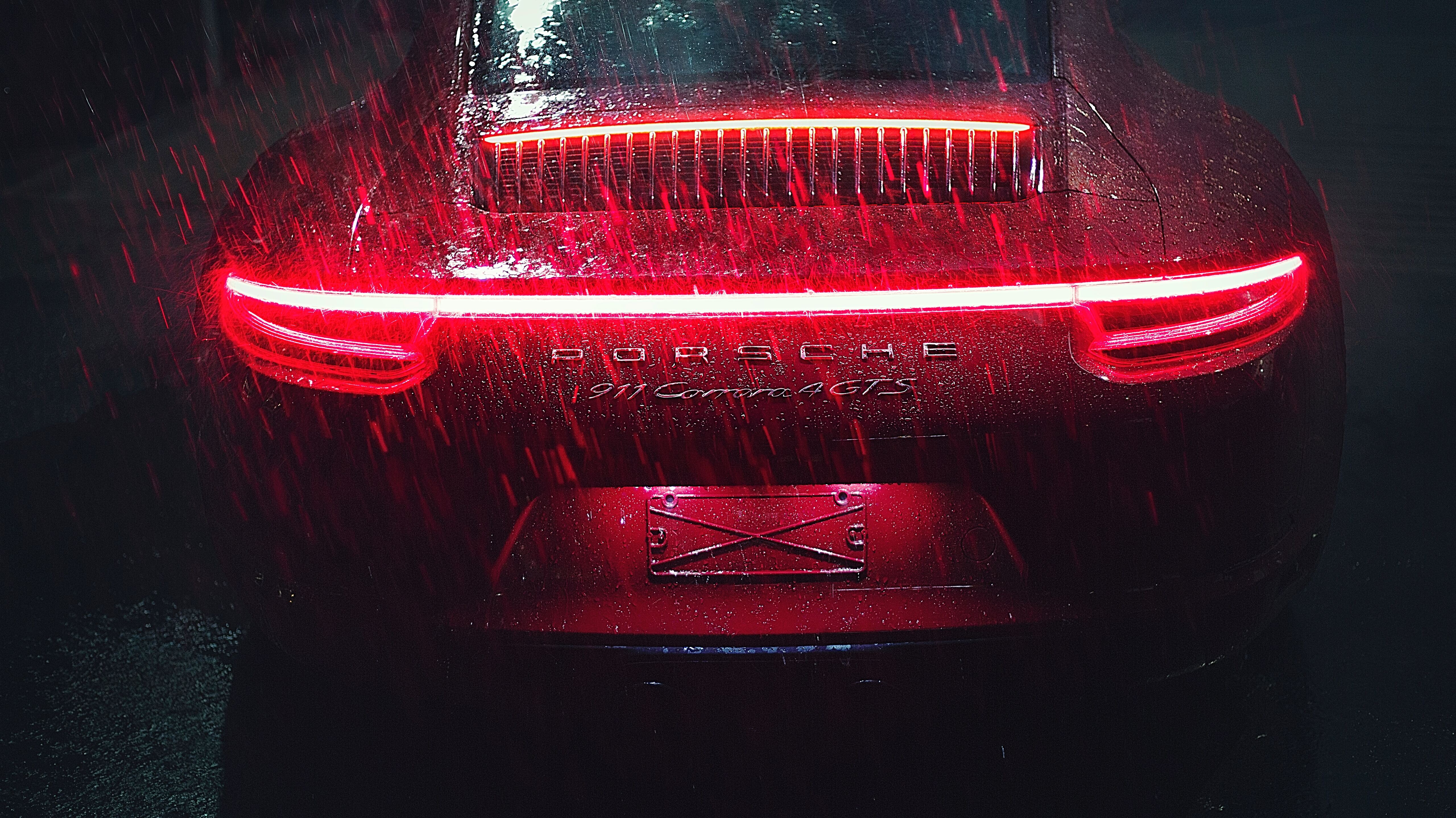 porsche-911-carrera-tail-light-raining-z4-5120x2880-3484639540.jpg