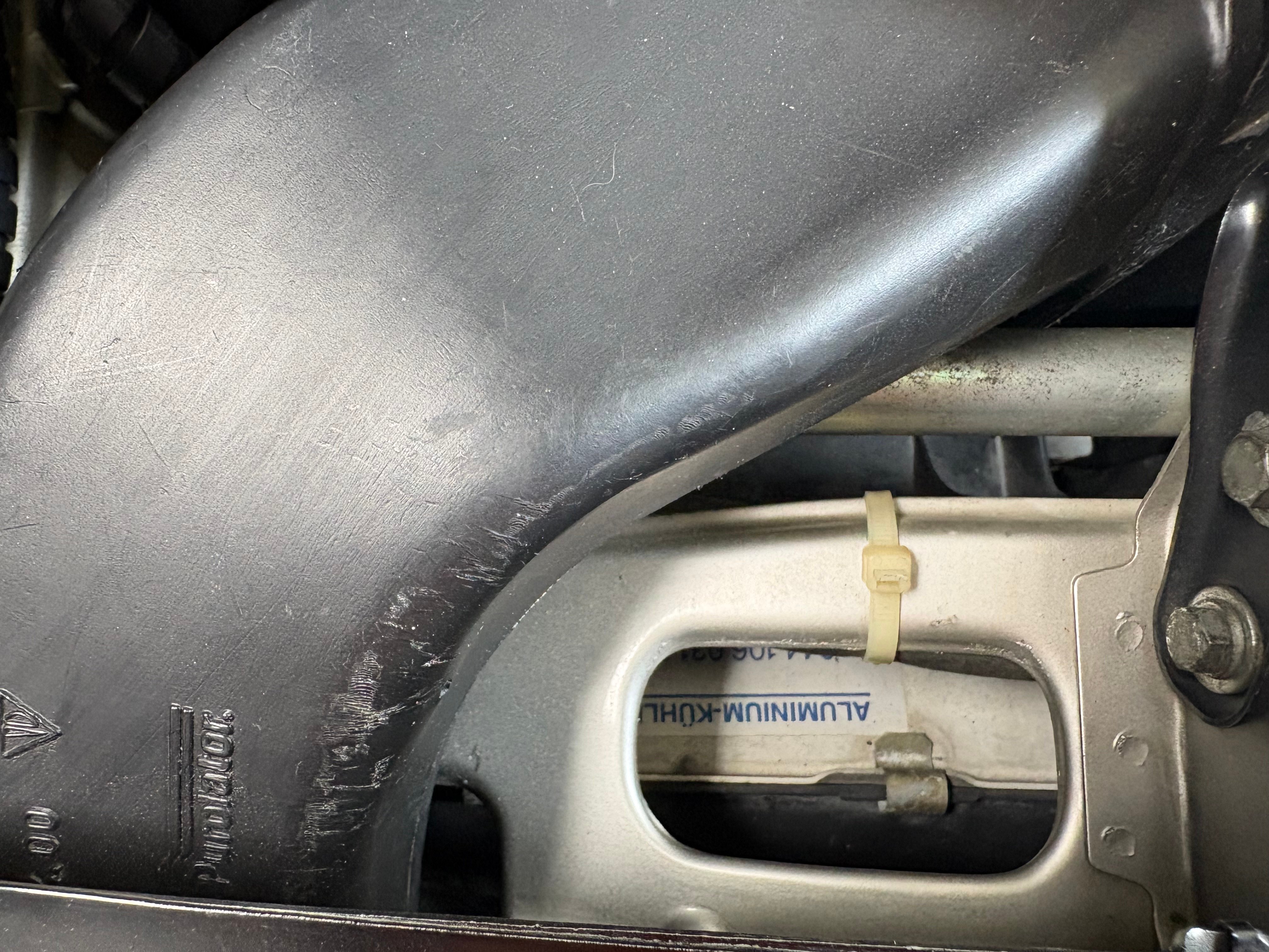 Hose zip tied above radiator