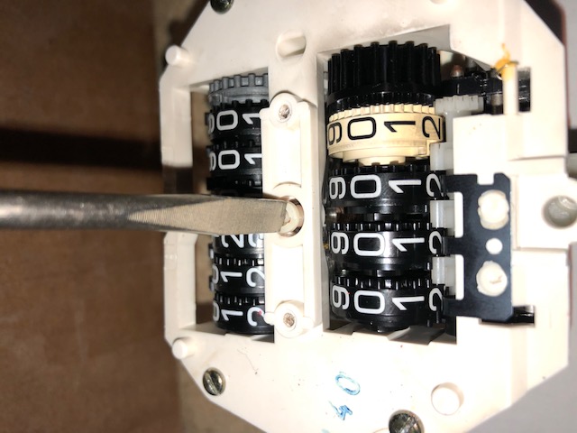 Plastic screw goes into center of speedometer