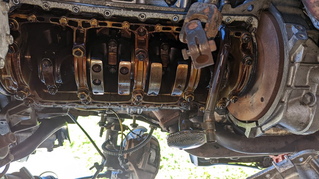 Underside, front of car to the left of photo