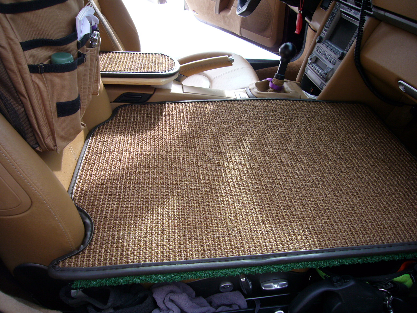 I built platforms and covered them with coco mats in the passenger seat and in the back.